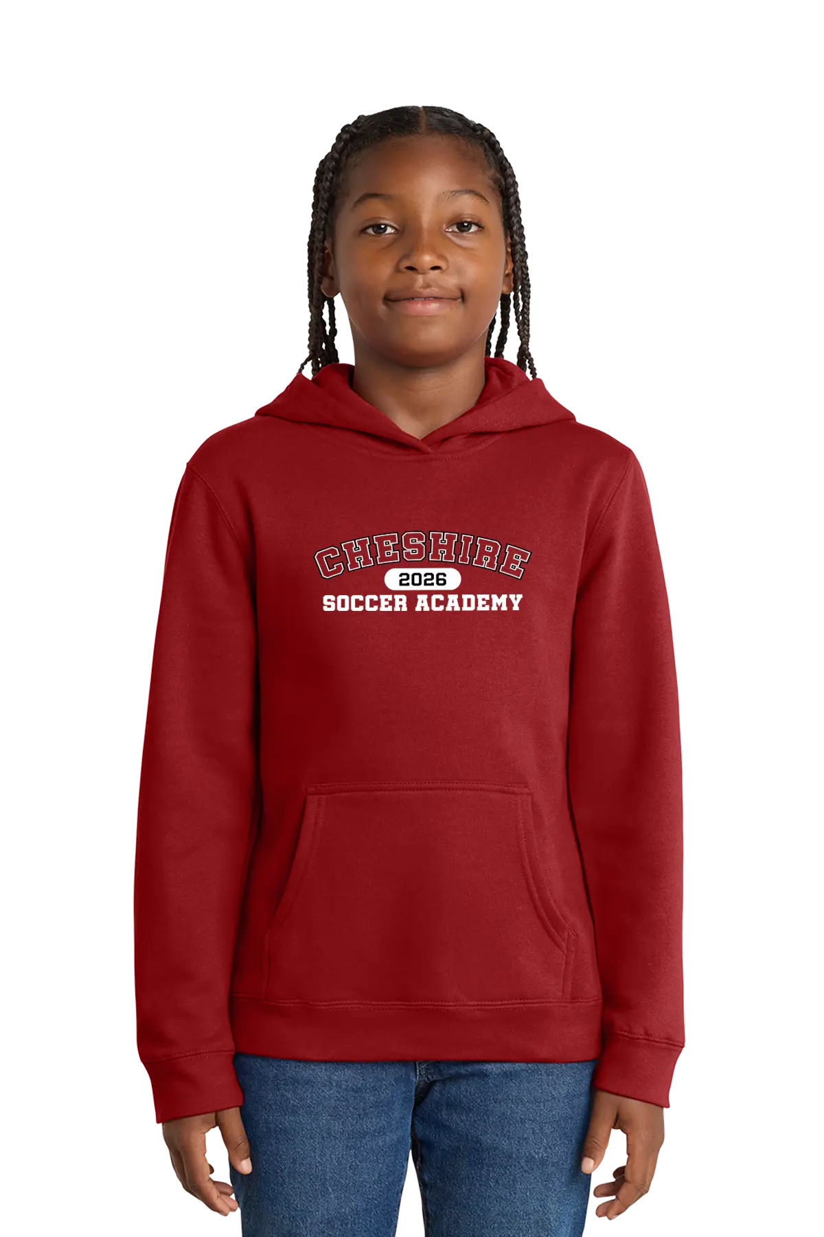 Child wearing a red hoodie with 'Cheshire Soccer Academy 2023' text on a white background. Paper Street Print Co, Blairstown, NJ.