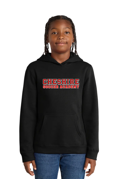 Person wearing a black hoodie with 'Cheshire Soccer Academy' text on a white background. Paper Street Print Co, Blairstown, NJ.