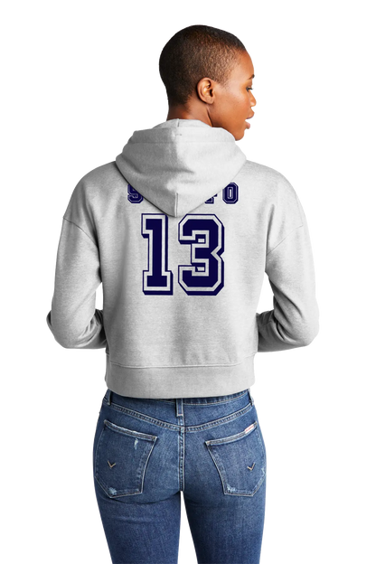 Person wearing a gray hoodie with a number 13 on the back, standing against a white background. Paper Street Print Co, Blairstown, NJ.