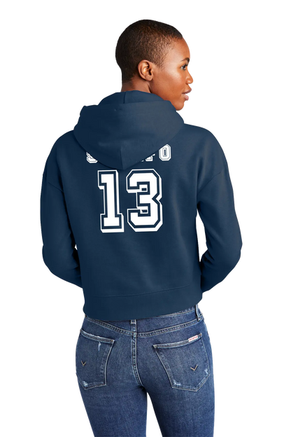 Person wearing a navy blue hoodie with white text on the back, standing against a white background. Paper Street Print Co, Blairstown, NJ.