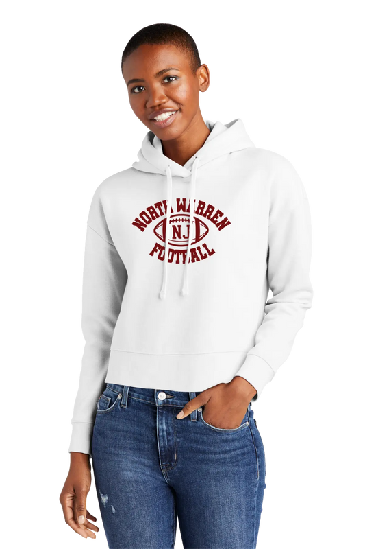 Woman wearing a white hoodie with 'Norty Warren Football' text, standing against a white background. Paper Street Print Co, Blairstown, NJ.