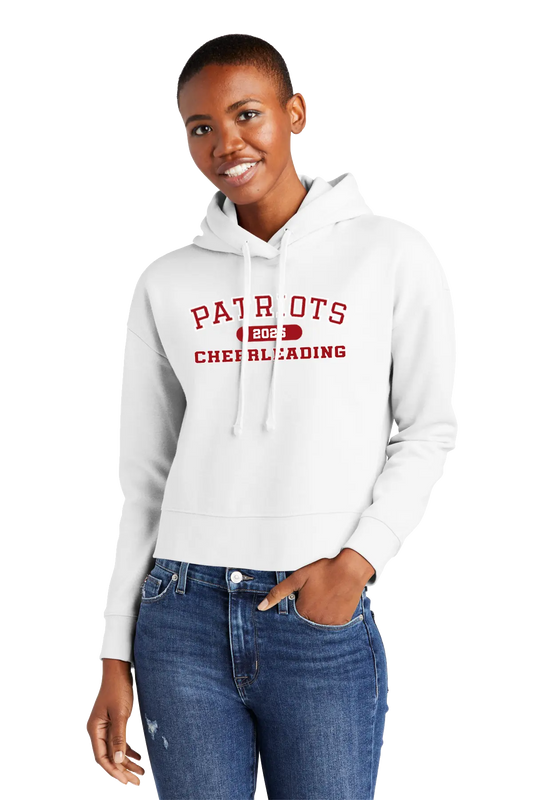 Woman wearing a white hoodie with 'Patriots Cheerleading' text on a white background. Paper Street Print Co, Blairstown, NJ. 
