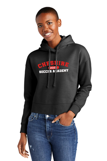 Person wearing a black hoodie with 'Cheshire Soccer Academy' text on a white background. Paper Street Print Co, Blairstown, NJ.
