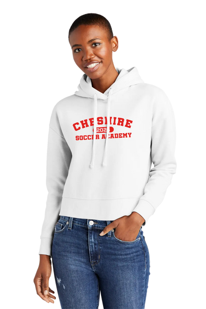 Person wearing a white hoodie with red text and blue jeans on a white background. Paper Street Print Co, Blairstown, NJ.