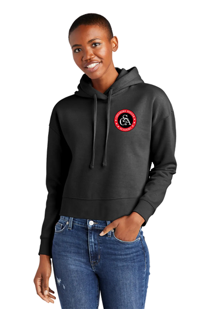 Person wearing a black hoodie with a red and white logo on a white background. Paper Street Print Co, Blairstown, NJ.