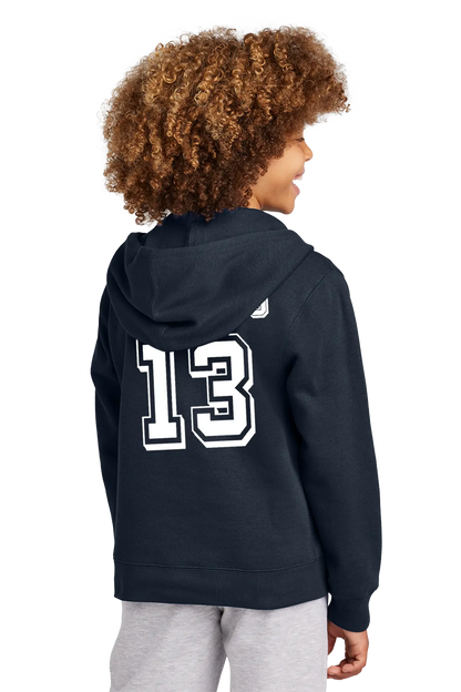 Person wearing a navy hoodie with the number 13 on the back, standing against a white background. Paper Street Print Co, Blairstown, NJ.