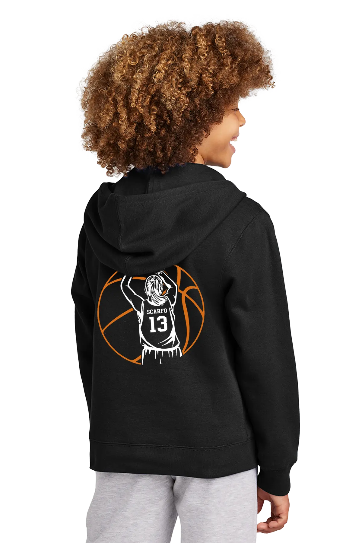 Person wearing a black hoodie with a basketball design on the back, standing against a white background. Paper Street Print Co, Blairstown, NJ.