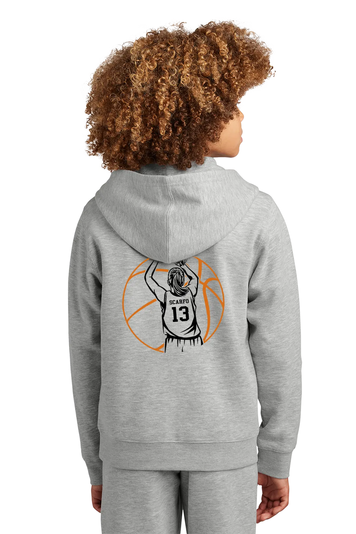 Child wearing a gray hoodie with a basketball player graphic on the back, on a white background. Paper Street Print Co, Blairstown, NJ.
