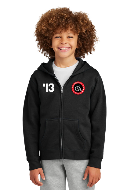 Child wearing a black hoodie with a logo and number on a white background. Paper Street Print Co, Blairstown, NJ.