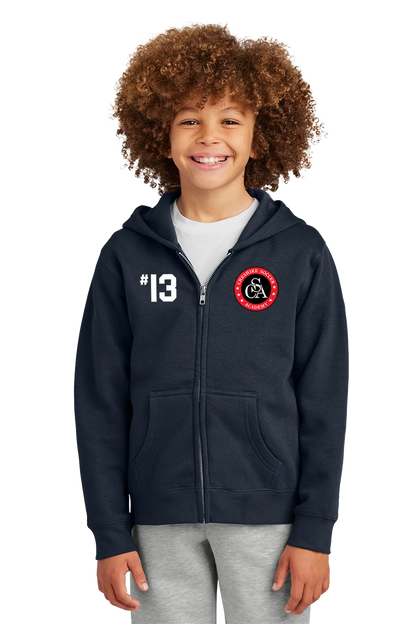 Child wearing a navy blue hoodie with a logo and number on a white background. Paper Street Print Co, Blairstown, NJ.