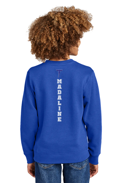 Child wearing a blue sweatshirt with 'MADALINE' printed on the back against a white background. Paper Street Print Co, Blairstown, NJ.