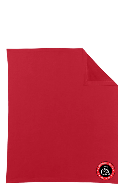 Red blanket with a logo in the corner on a white background. Paper Street Print Co, Blairstown, NJ.