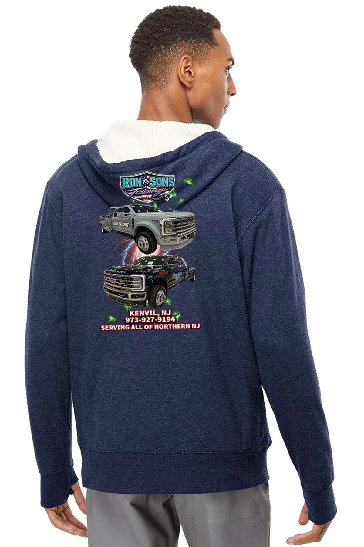 Person wearing a navy blue hoodie with graphics on the back, standing against a white background. Ron and Sons Towing, Paper Street Print Co, Blairstown, NJ.