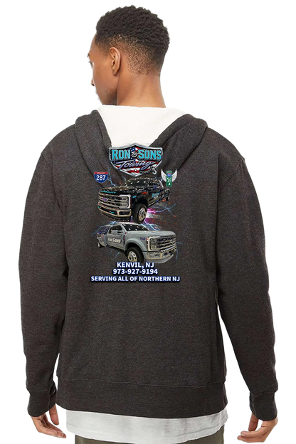 Person wearing a dark hoodie with a graphic design on the back, featuring vehicles and text. Ron and Sons Towing, Paper Street Print Co, Blairstown, NJ.