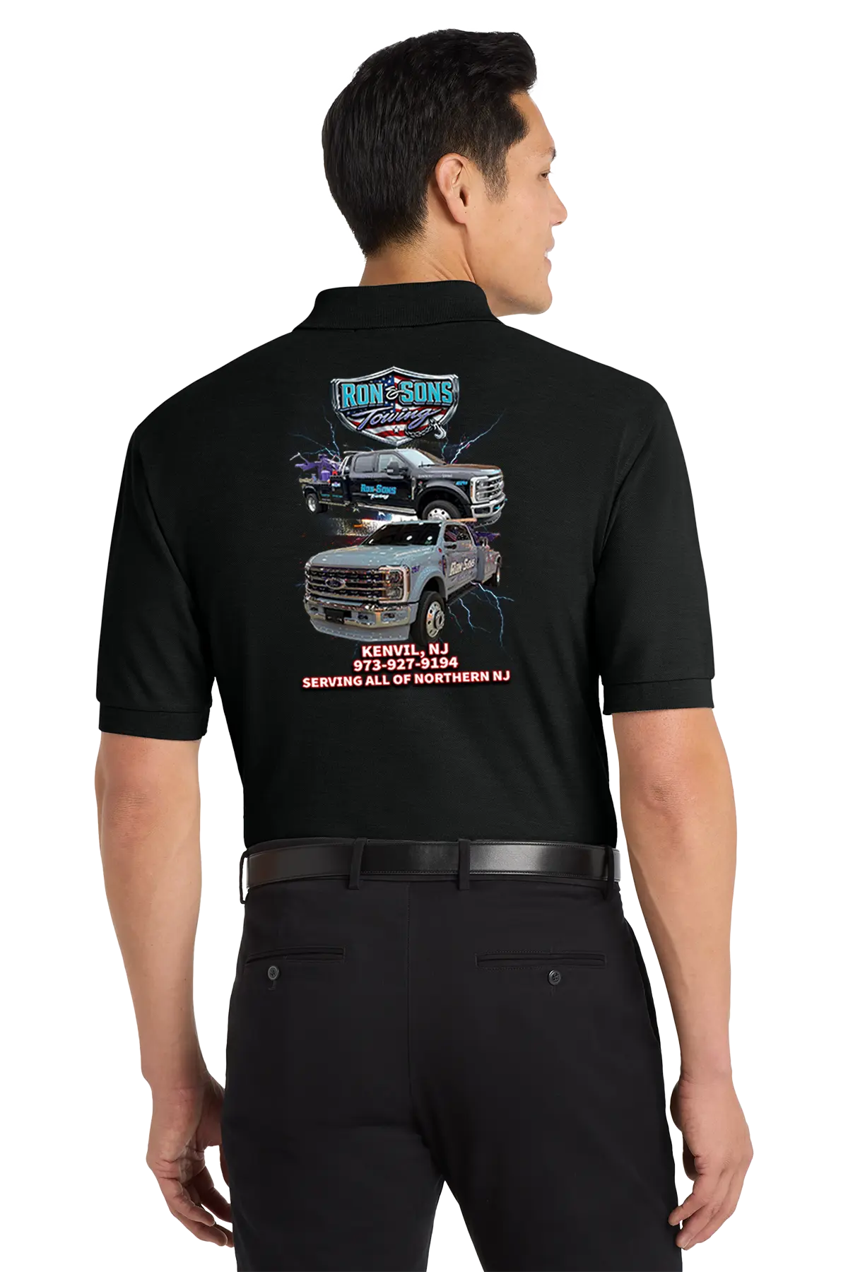 Person wearing a black work shirt with graphics and text on the back, standing against a white background. Ron and Sons Towing, Paper Street Print Co, Blairstown, NJ.