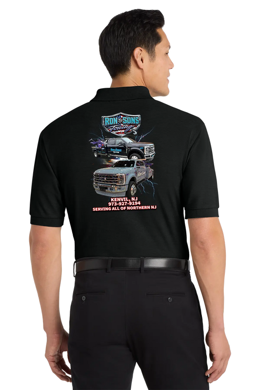 Person wearing a black work shirt with graphics and text on the back, standing against a white background. Ron and Sons Towing, Paper Street Print Co, Blairstown, NJ.