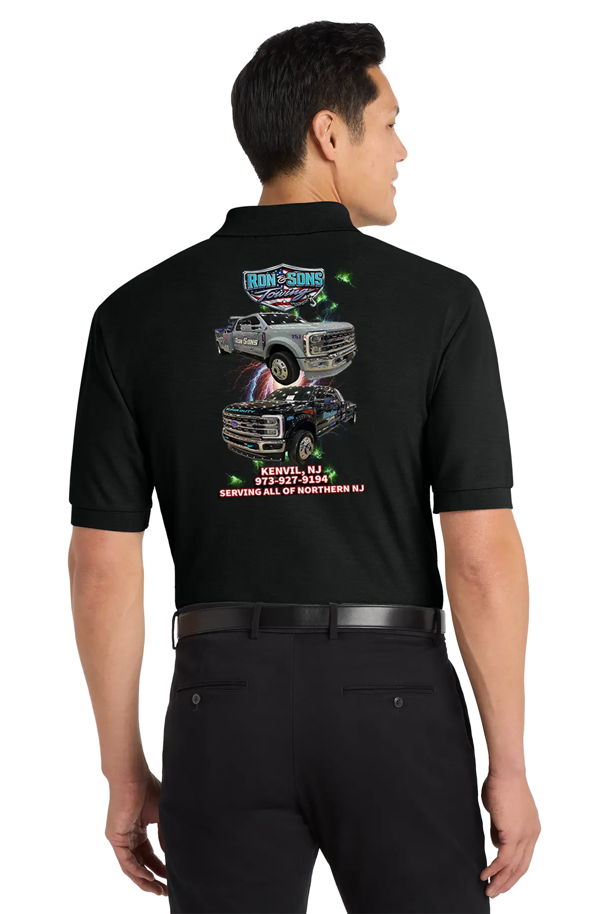Person wearing a black shirt with graphics and text on the back, standing against a white background. Ron and Sons Towing, Paper Street Print Co, Blairstown, NJ.