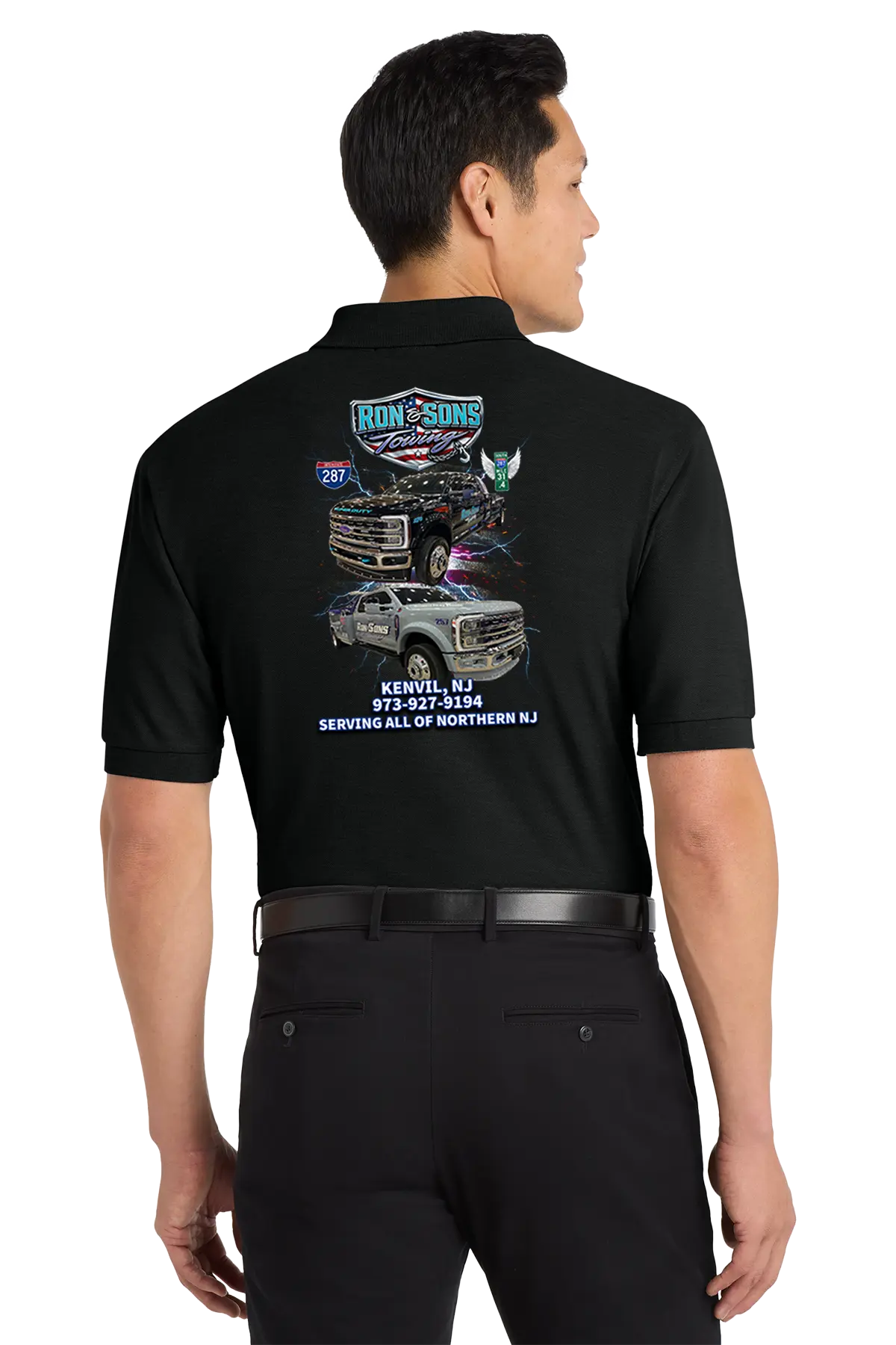 Person wearing a black shirt with graphics and text on the back, standing against a white background. Ron and Sons Towing, Paper Street Print Co, Blairstown, NJ.