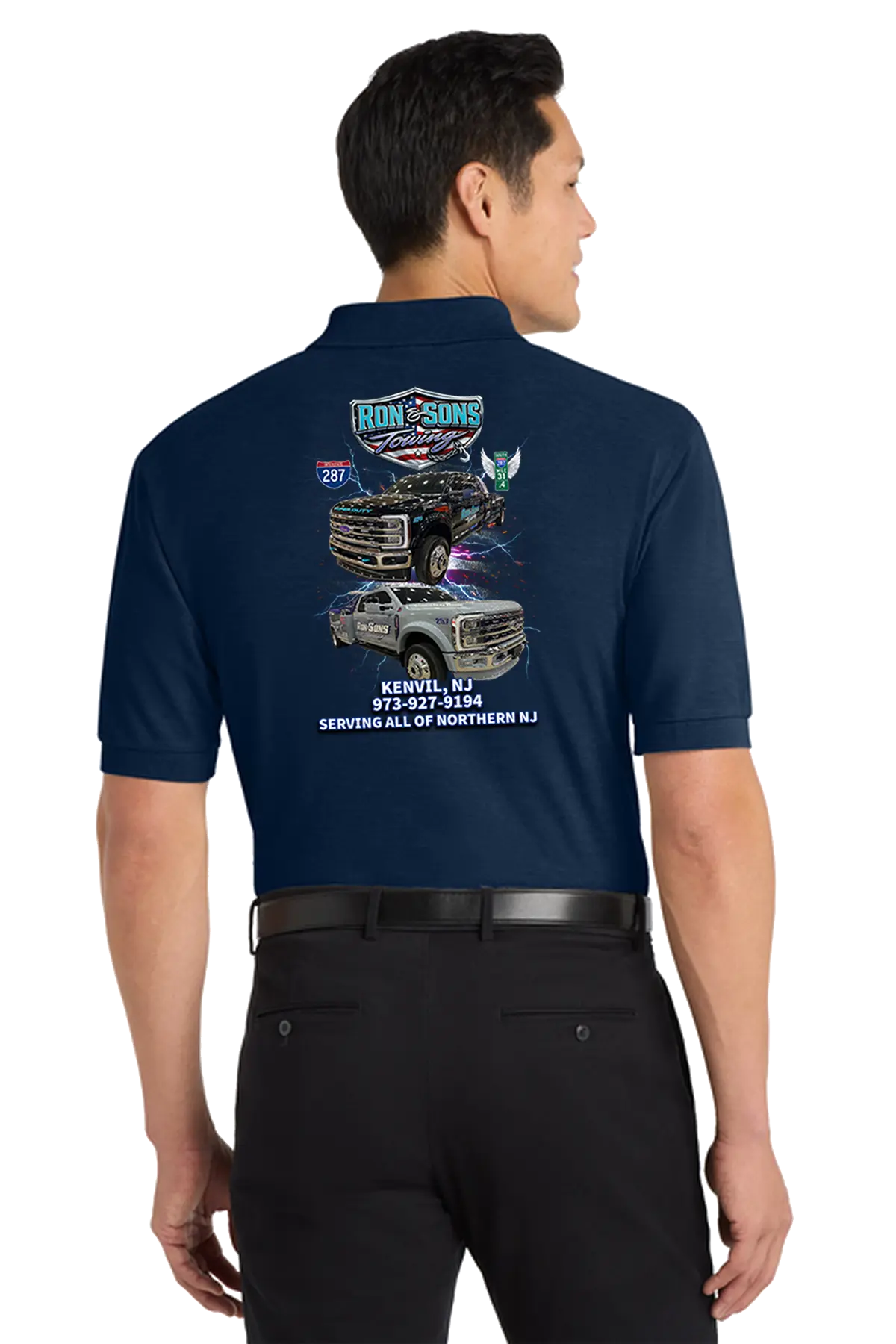 Man wearing a navy blue shirt with graphics and text on the back, standing against a white background. Ron and Sons Towing, Paper Street Print Co, Blairstown, NJ.