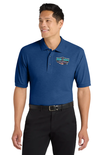 Man wearing a blue polo shirt with a logo on a white background. Ron and Sons Towing, Paper Street Print Co, Blairstown, NJ.