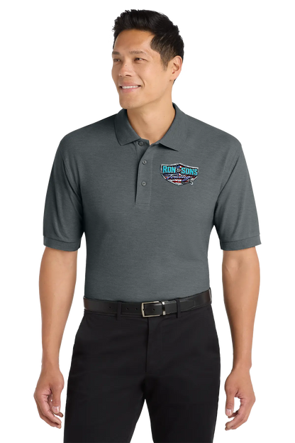 Man wearing a gray polo shirt with a logo on a white background. Ron and Sons Towing, Paper Street Print Co, Blairstown, NJ.