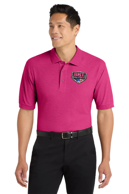 Man wearing a pink polo shirt with a logo on a white background. BRT Towing and Recovery, Paper Street Print Co, Blairstown, NJ.