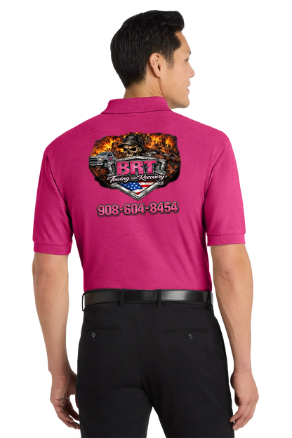 Person wearing a pink shirt with a logo and contact information on the back, on a white background. BRT Towing and Recovery, Paper Street Print Co, Blairstown, NJ.