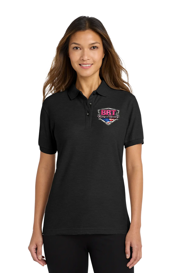 Woman wearing a black polo shirt with a logo on a white background. BRT Towing & Recovery, Paper Street Print Co, Blairstown, NJ.