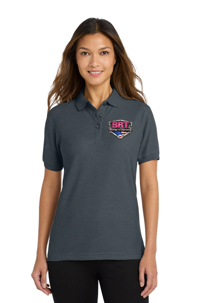 Woman wearing a dark gray polo shirt with a logo on a white background. BRT Towing & Recovery, Paper Street Print Co, Blairstown, NJ.