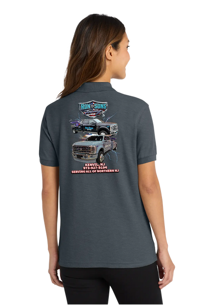 Person wearing a dark gray polo shirt with a graphic on the back, standing against a white background. Ron and Sons Towing, Paper Street Print Co, Blairstown, NJ.