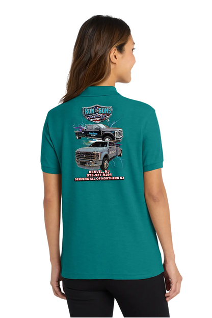 Person wearing a teal t-shirt with a graphic of a truck on the back, on a white background. Ron and Sons Towing, Paper Street Print Co, Blairstown, NJ.