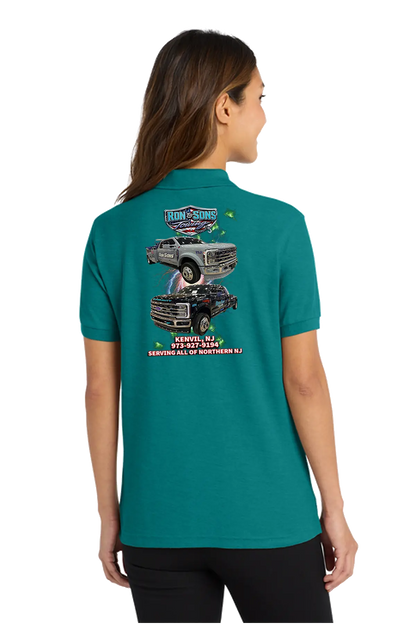 Person wearing a teal t-shirt with a graphic design on the back, standing against a white background. Ron and Sons Towing, Paper Street Print Co, Blairstown, NJ.