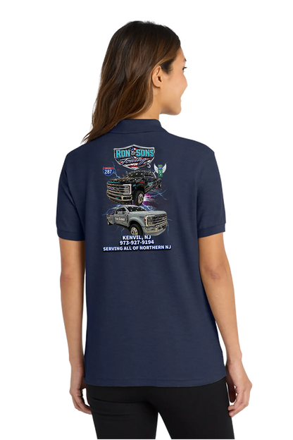 Person wearing a navy blue polo shirt with graphics on the back. Ron and Sons Towing, Paper Street Print Co, Blairstown, NJ.