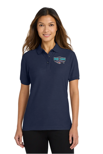 Woman wearing a navy blue polo shirt with a logo on a white background. Ron and Sons Towing, Paper Street Print Co, Blairstown, NJ.