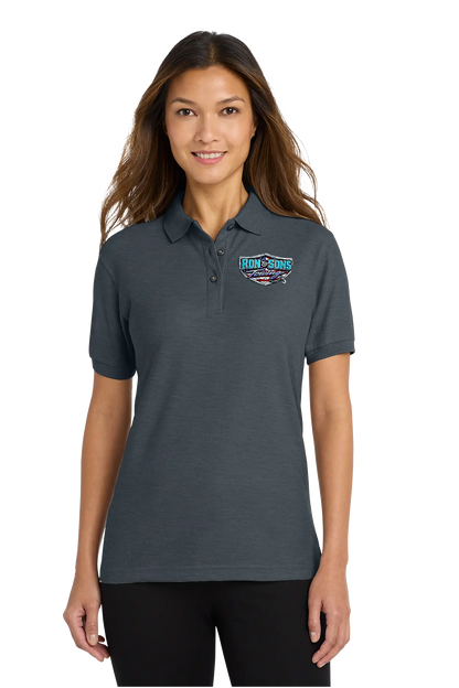 Woman wearing a dark gray polo shirt with a logo on a white background. Ron and Sons Towing, Paper Street Print Co, Blairstown, NJ.