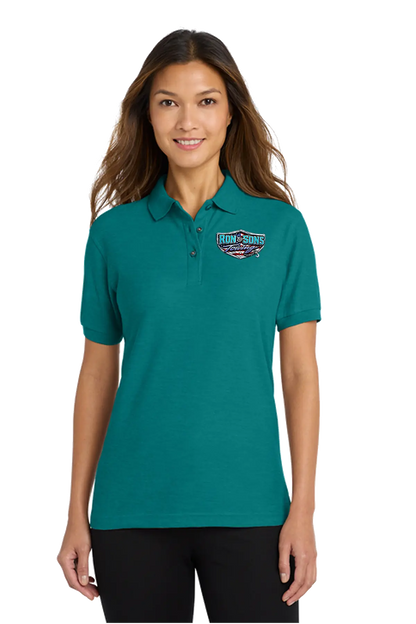 Woman wearing a teal polo shirt with a logo on a white background. Ron and Sons Towing, Paper Street Print Co, Blairstown, NJ.