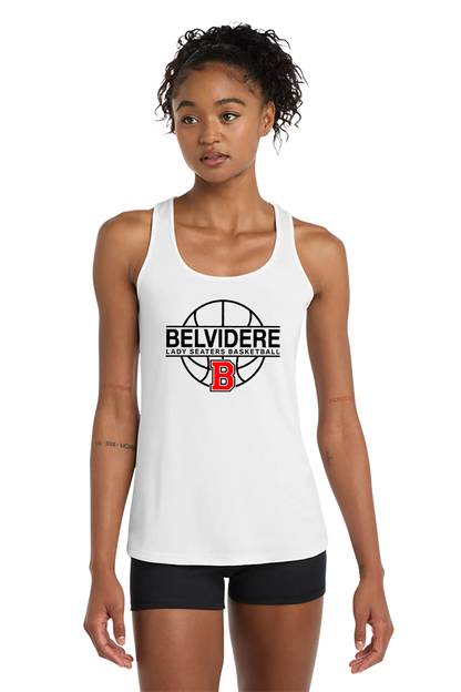 A woman modeling a white racerback tank top with a black and red Belvidere Lady Seaters Basketball logo on the chest, paired with black athletic shorts, against a plain white background. Paper Street Print Co, Blairstown, NJ.