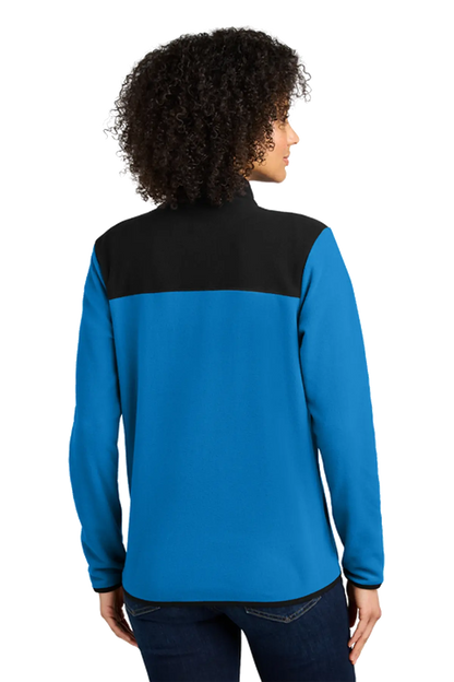 Person wearing a blue and black long-sleeve shirt on a white background. Titan Elite Cheerleading, Paper Street Print Co, Blairstown, NJ.