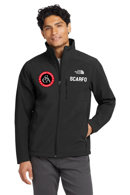 Person wearing a black jacket with logos on a white background. Paper Street Print Co, Blairstown, NJ.