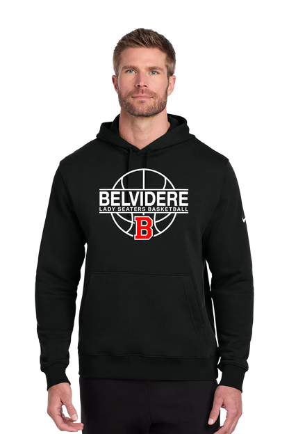 A man wearing a black pullover hoodie with a white and red 'Belvidere Lady Seaters Basketball' graphic on the chest, featuring a red 'B' logo. A small white Nike swoosh is visible on the right sleeve. Paper Street Print Co, Blairstown, NJ.