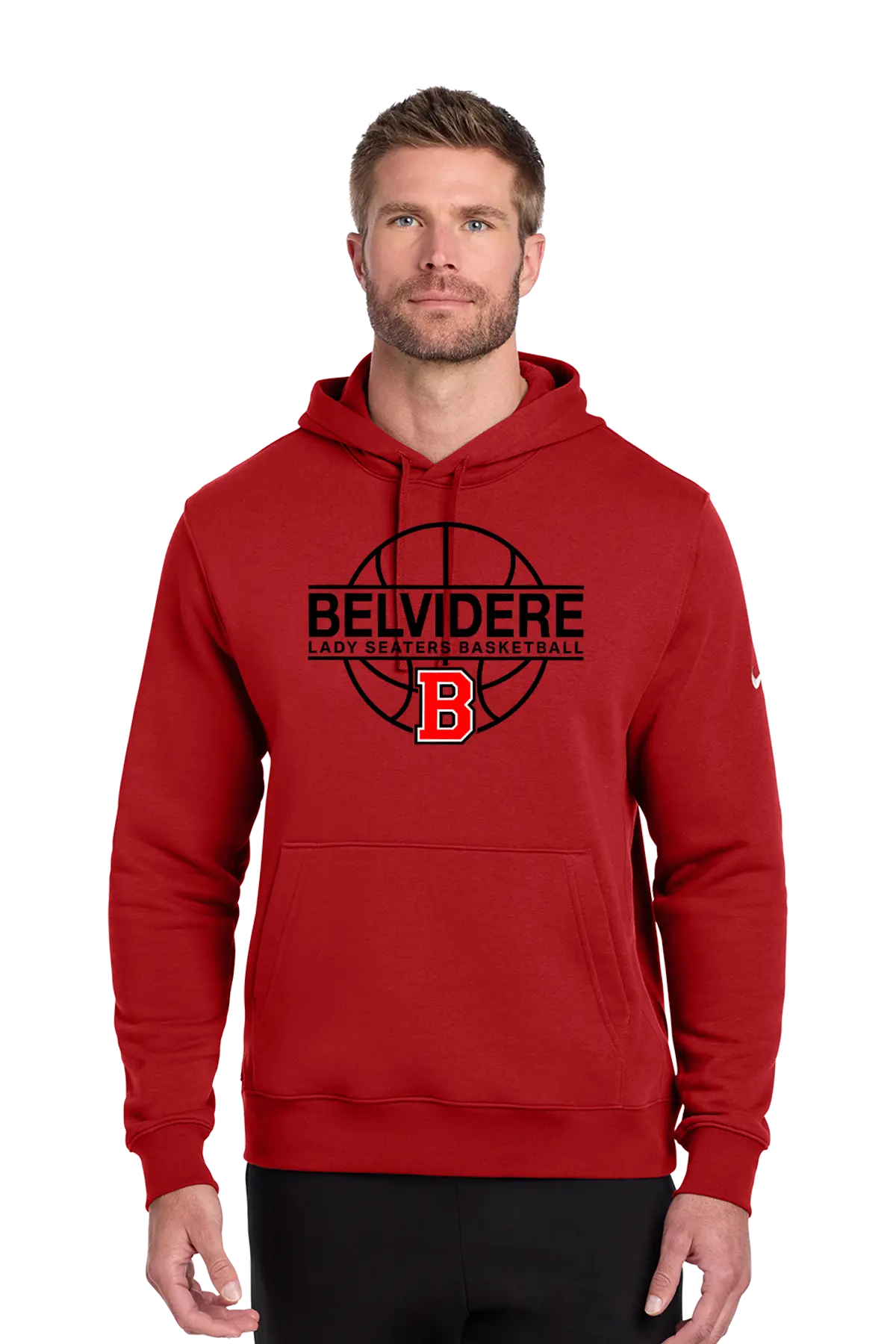 A man wearing a red pullover hoodie with a black and red 'BELVIDERE LADY SEATERS BASKETBALL' graphic and a red 'B' logo on the chest, paired with black pants, against a plain white background. Paper Street Print Co, Blairstown, NJ.