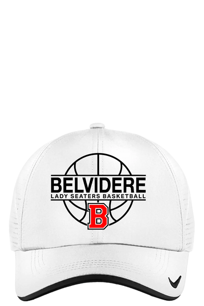 A white structured baseball cap with a black mesh back, featuring a front graphic for 'Belvidere Lady Seaters Basketball' with a basketball design, a red 'B' logo, and a small black swoosh on the brim. Paper Street Print Co, Blairstown, NJ.