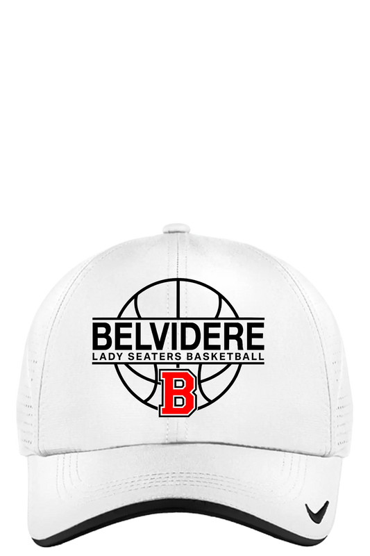 A white structured baseball cap with a black mesh back, featuring a front graphic for 'Belvidere Lady Seaters Basketball' with a basketball design, a red 'B' logo, and a small black swoosh on the brim. Paper Street Print Co, Blairstown, NJ.