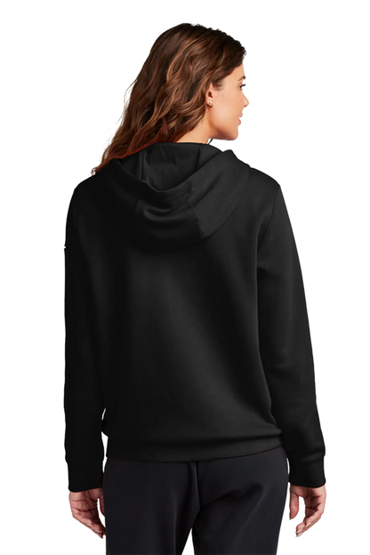 A woman shown from the back wearing a black pullover hoodie and black pants against a plain white studio background. Blairstown Lady Seaters Basketball, Paper Street Print Co, Blairstown, NJ.