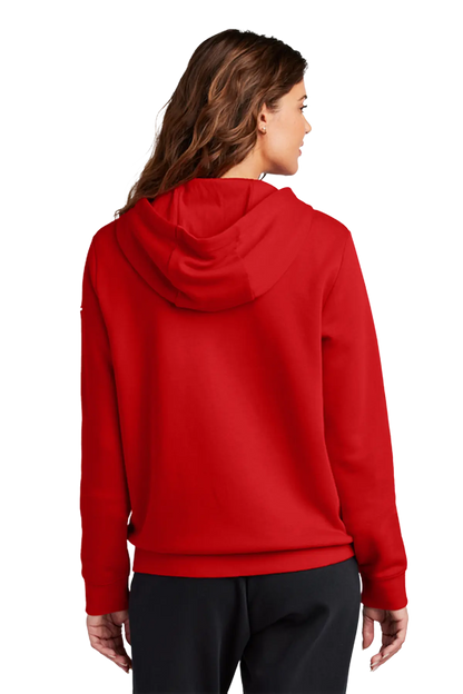 A woman shown from the back wearing a bright red pullover hoodie and black pants against a plain white studio background. Blairstown Lady Seaters Basketball, Paper Street Print Co, Blairstown, NJ.