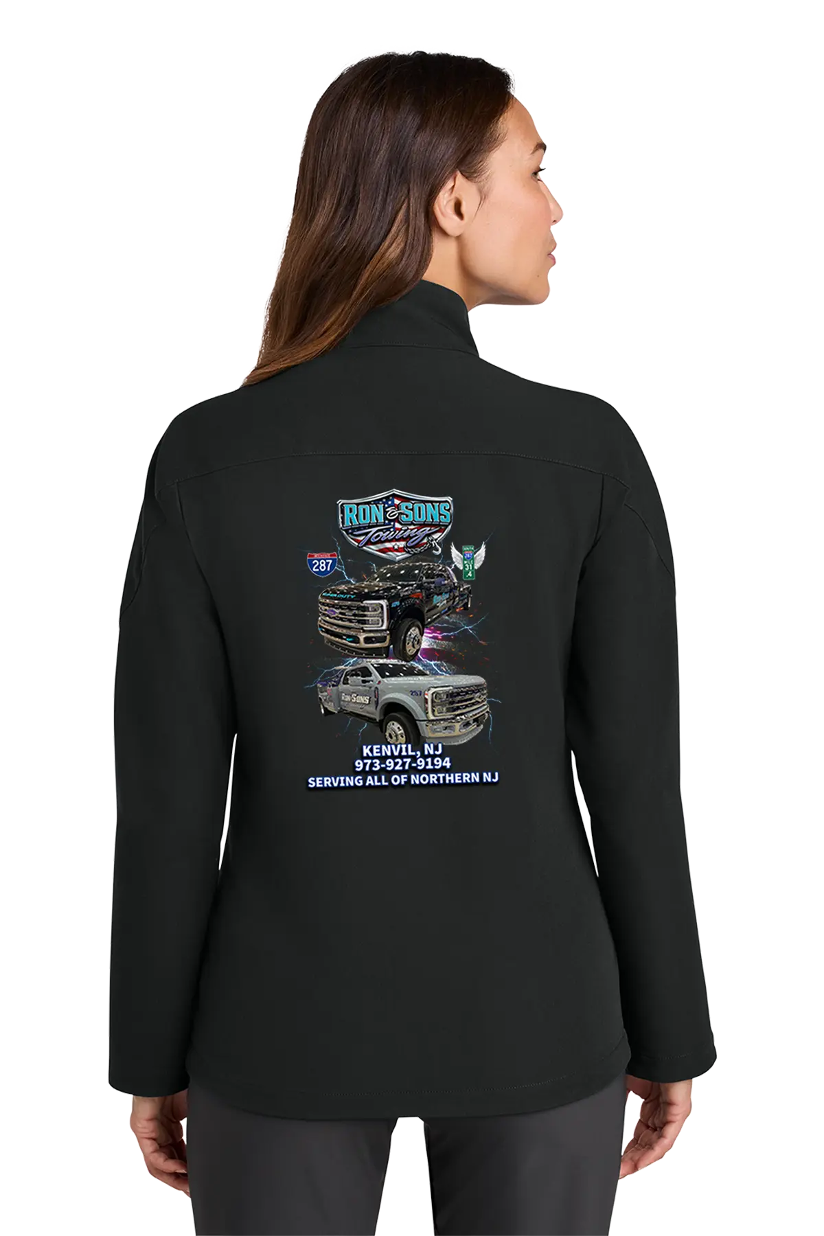 Person wearing a black jacket with a graphic design on the back, standing against a white background. Ron and Sons Towing, Paper Street Print Co, Blairstown, NJ.