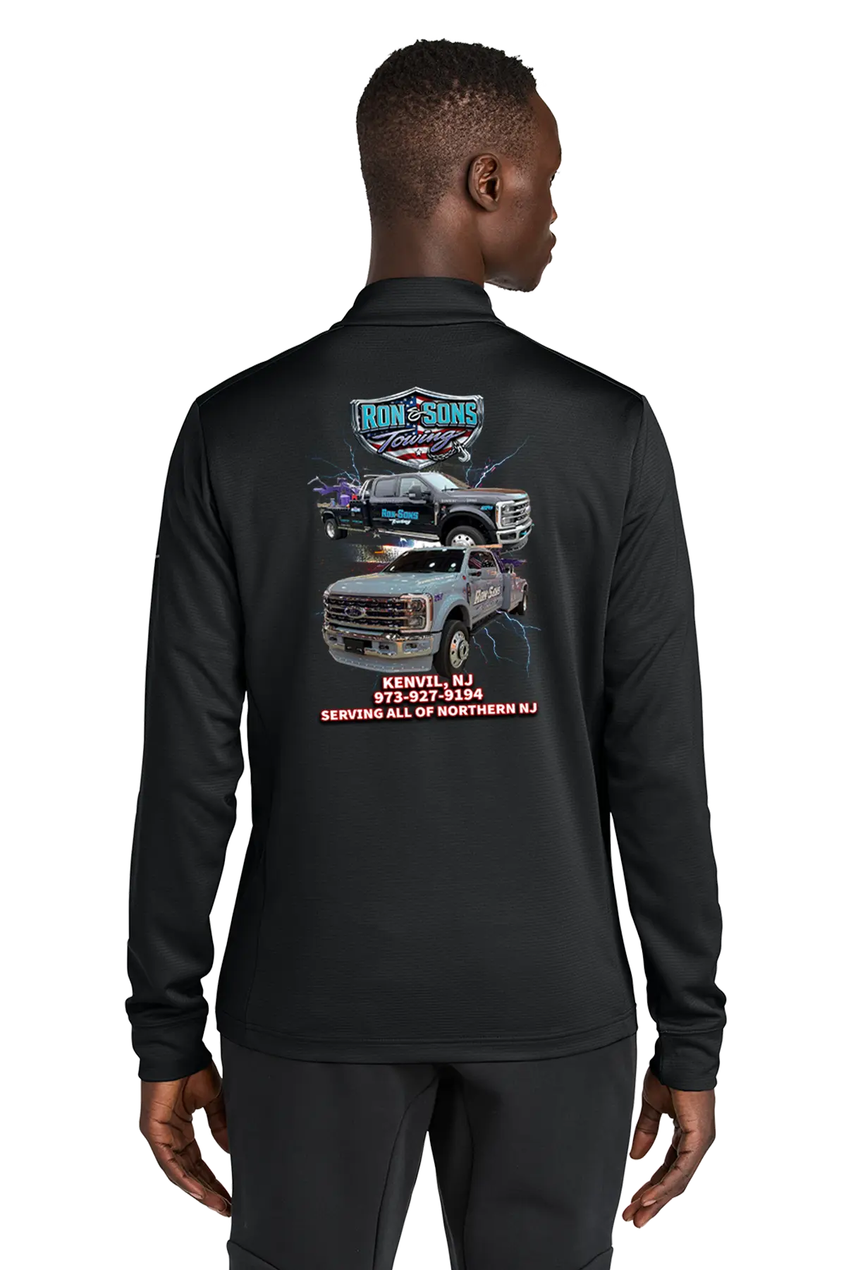 Black long-sleeve shirt with graphics and text on the back, worn by a person. Ron and Sons Towing, Paper Street Print Co, Blairstown, NJ.