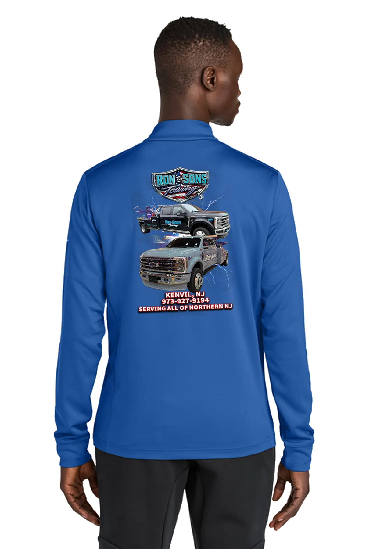 Person wearing a blue long-sleeve shirt with a graphic design on the back, standing against a white background. Ron and Sons Towing, Paper Street Print Co, Blairstown, NJ.