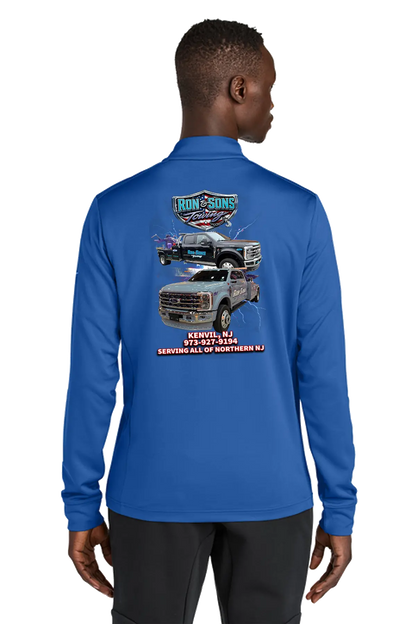 Person wearing a blue long-sleeve shirt with a graphic design on the back, standing against a white background. Ron and Sons Towing, Paper Street Print Co, Blairstown, NJ.