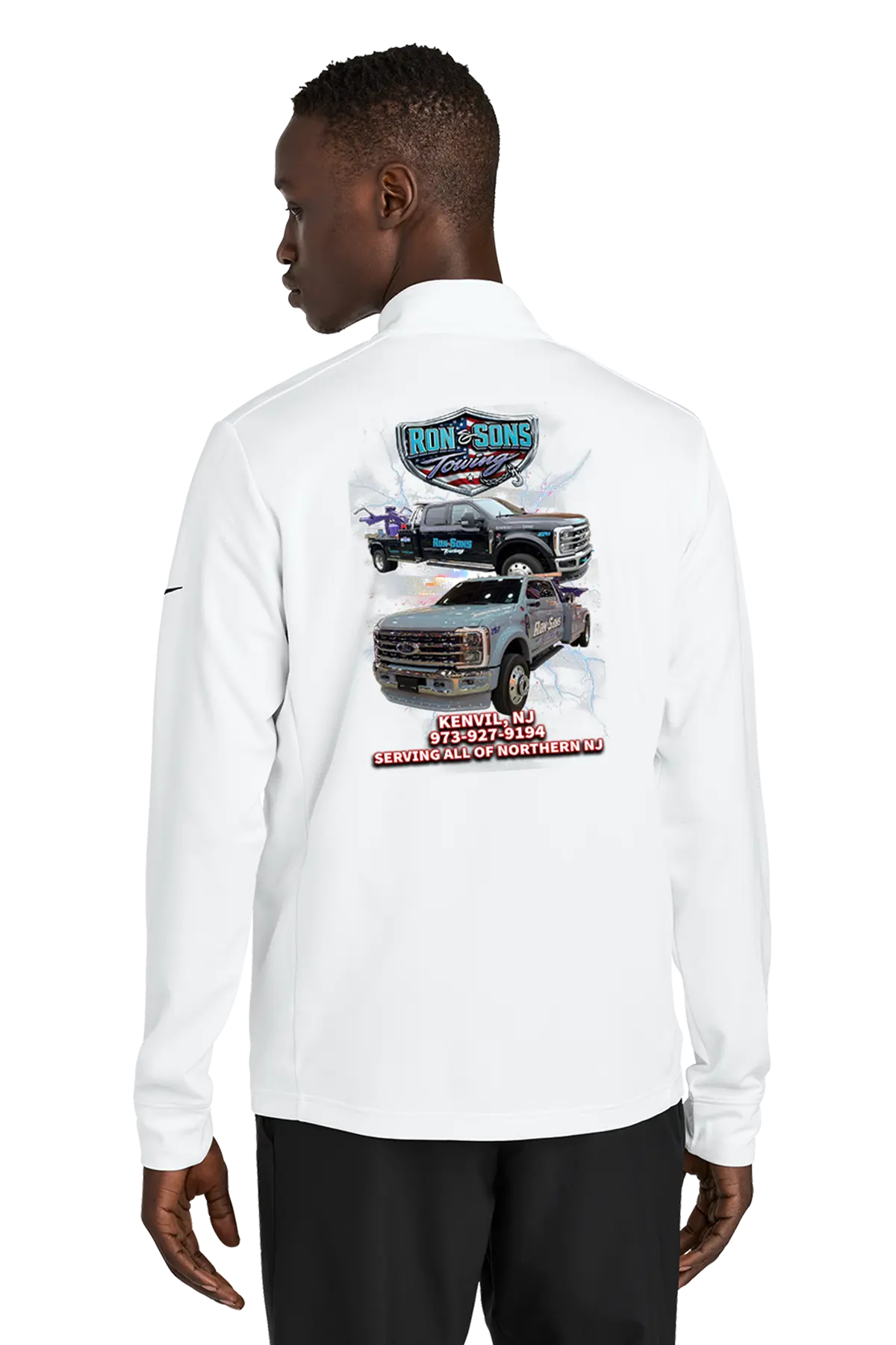 Person wearing a white long-sleeve shirt with graphics on the back, standing against a white background. Ron and Sons Towing, Paper Street Print Co, Blairstown, NJ.